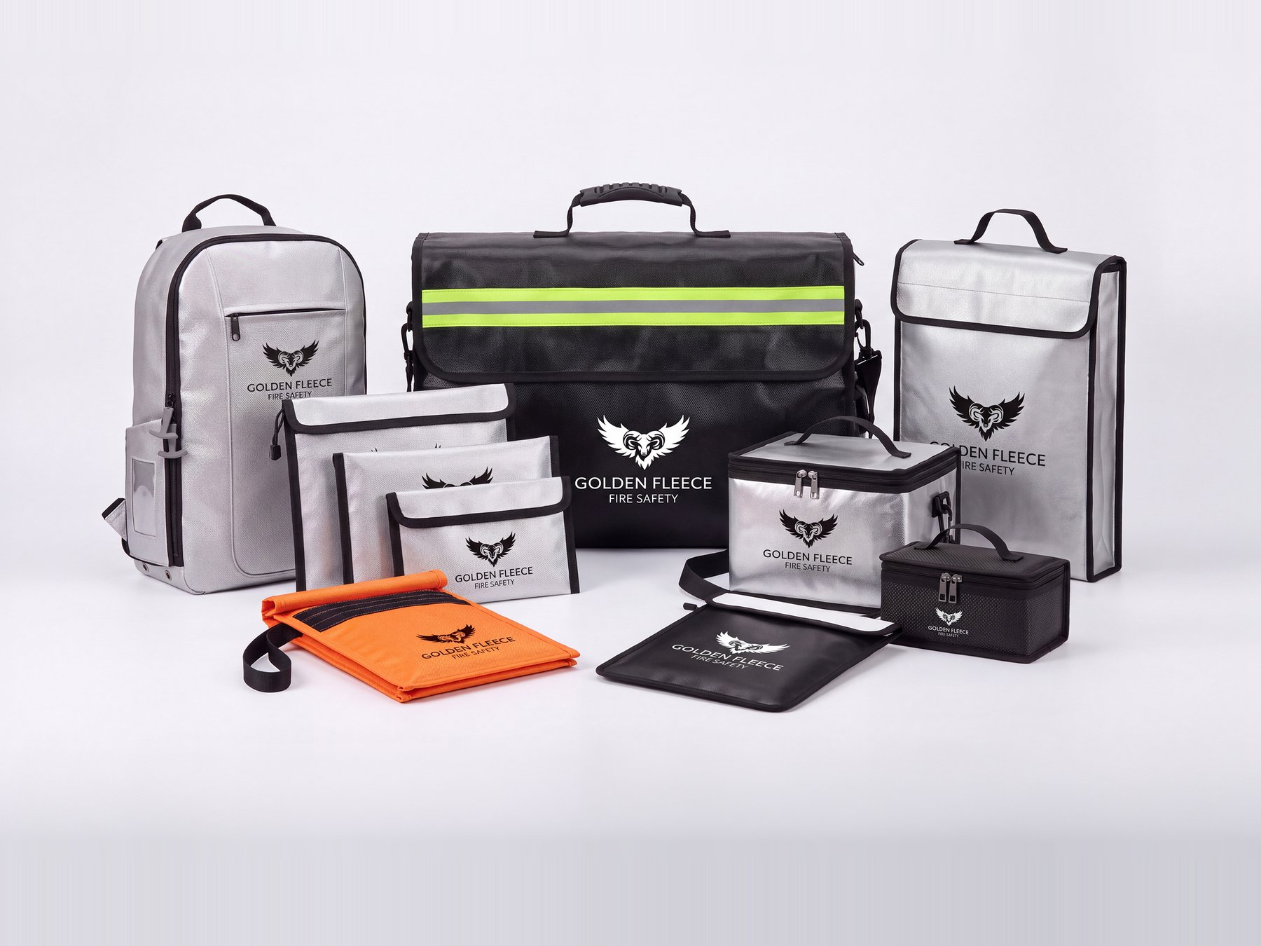 The Golden Fleece Fire Safety fire-resistant storage range — backpack, document satchel, zipped pouches and hard-sided battery cases in silver and black, each carrying the ram-and-wings brand mark, for holding at-risk and suspect lithium-ion items segregated and unattended.